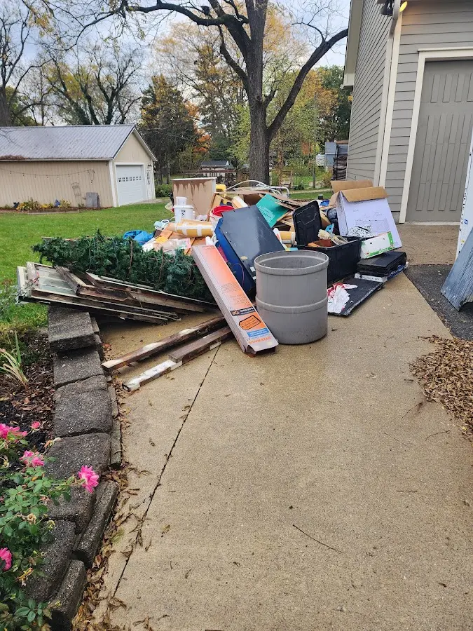 Dumpster being loaded with debris for Residential Dumpster Rental in Glennville